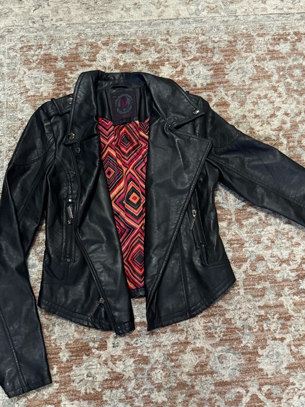 Dollhouse Black Faux Leather Moto Jacket with Geometric cool Red-Orange Lining